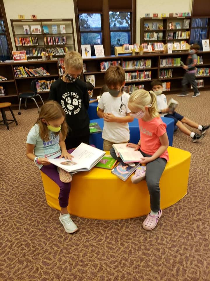 masked students at a library