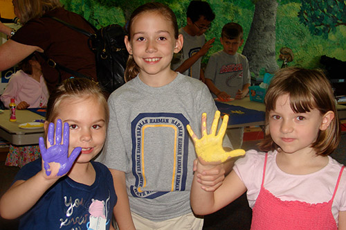 students with paint on hands