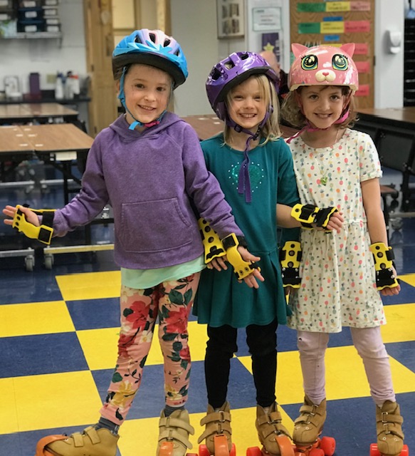 Kindergartners learning to rollerskate